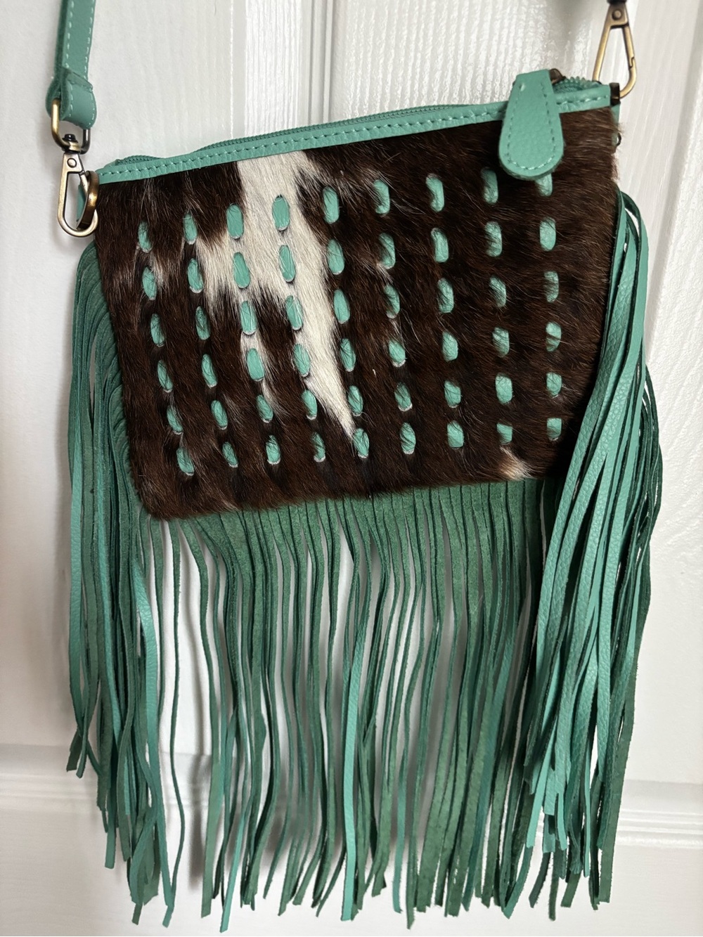 Brand New Western Linens Turquoise
Fringe and cowhide Crossbody